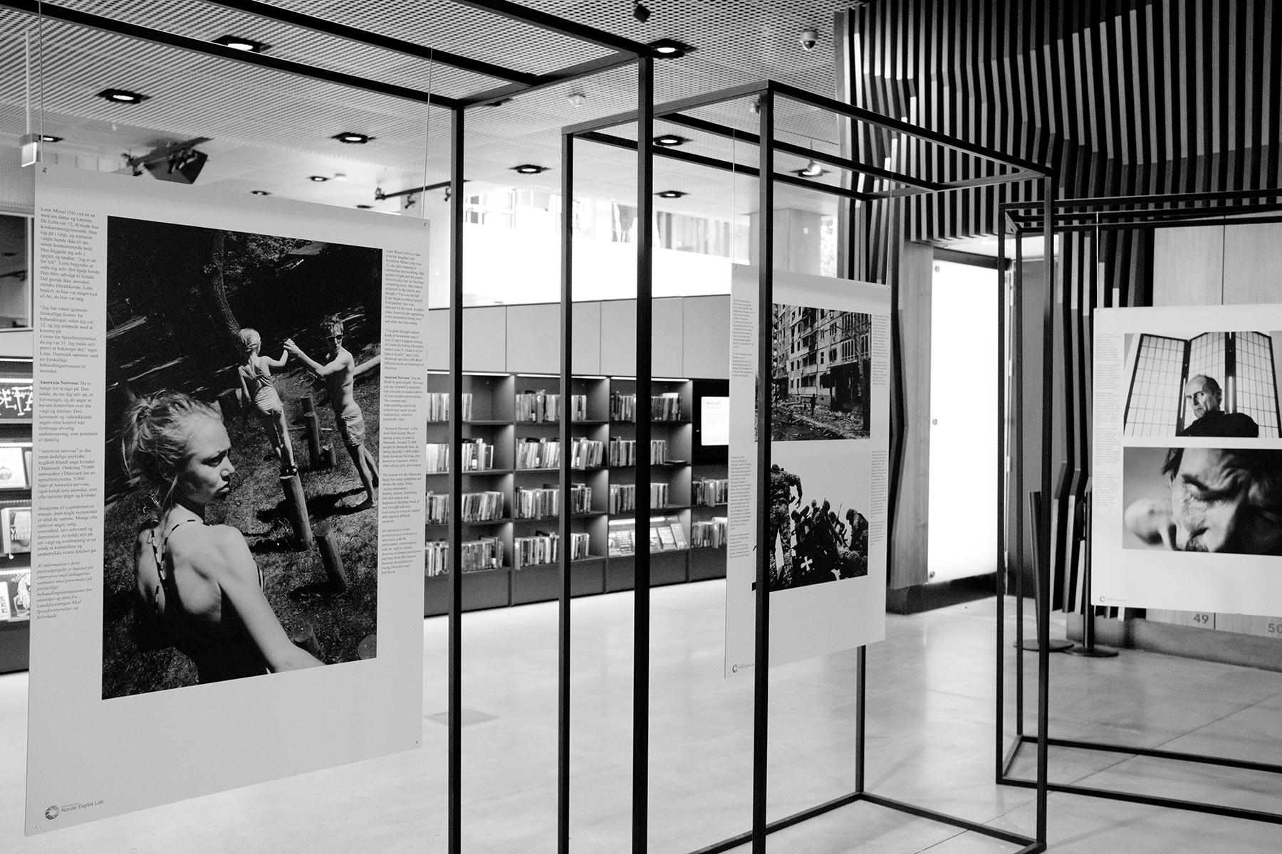 Setting up exhibition prints on stands