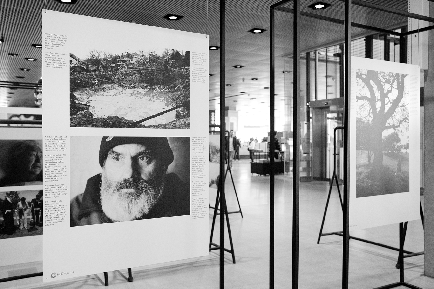 Audience looking at a photo exhibition produced by Nordic Digital Lab
